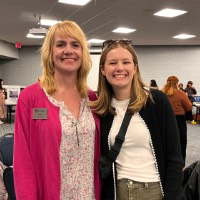 Lisa Knapp from GVSU Career Center poses with a woman.